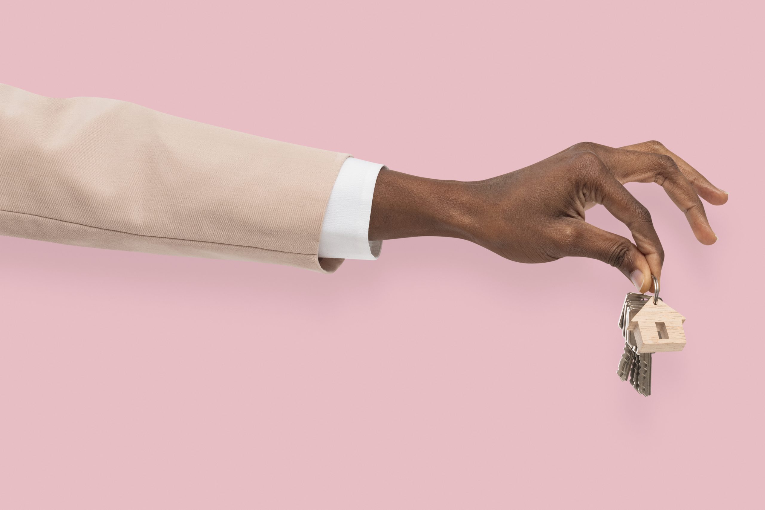 hand holding key real estate agent